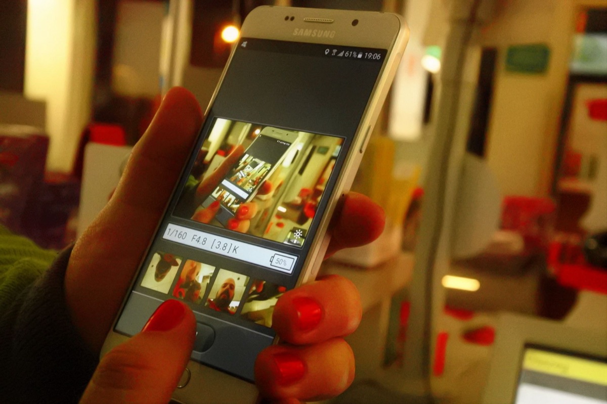 Close-up of a person using a mobile video editing application on a smartphone